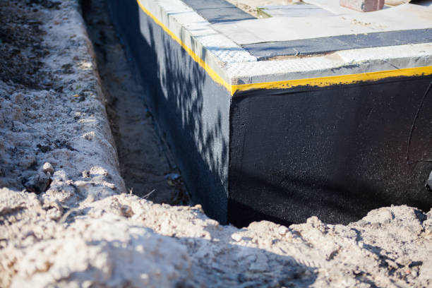Professional Emergency Waterproofing technician working in Montrose, MI